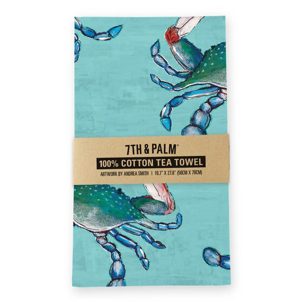 Aqua blue tea towel with blue crab design and '7th & Palm' branding on a white background.
