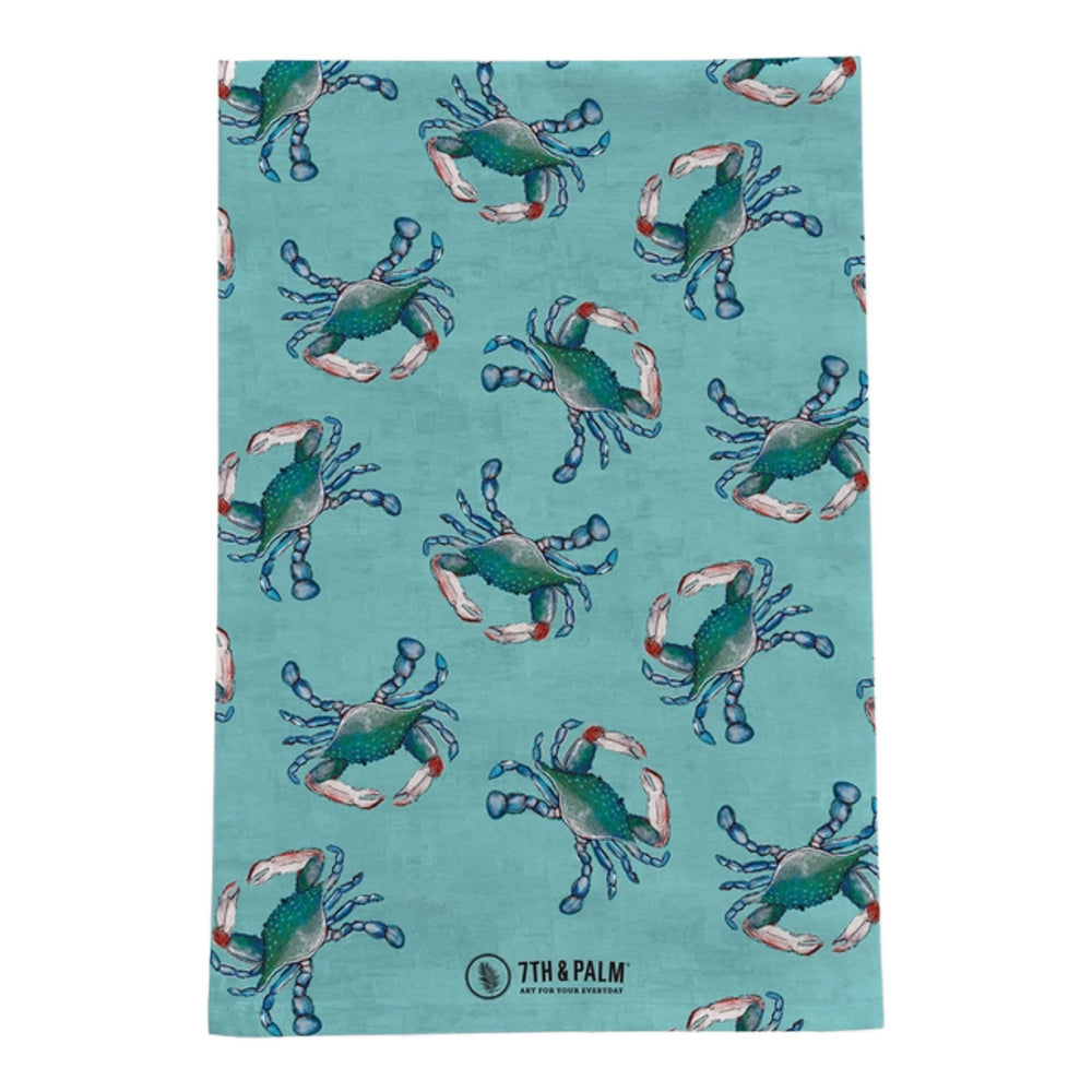 Aqua blue tea towel with blue crab design on a white background.