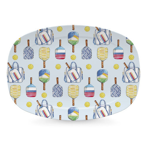 Patterned tray with colorful paddle designs on a light blue background.