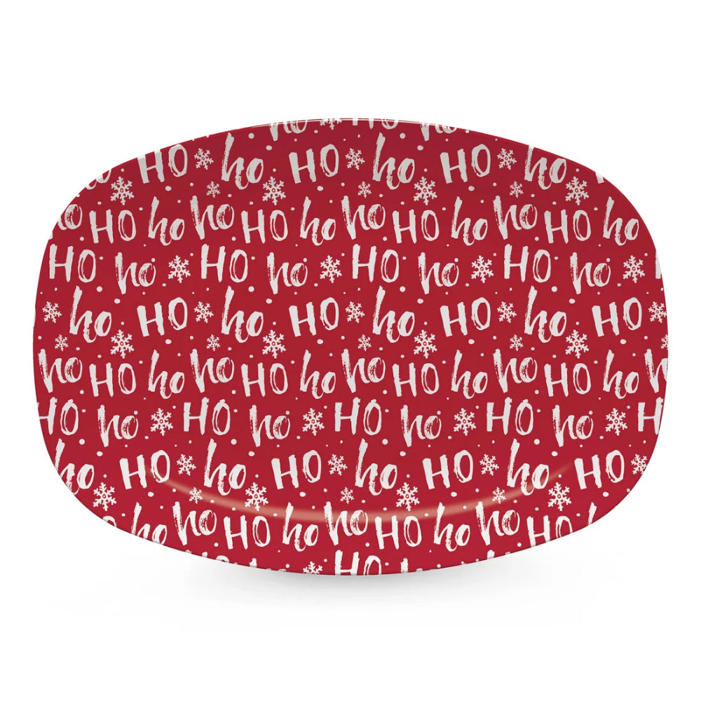 An oval-shaped decorative plate or tray with a festive red and white holiday pattern featuring the text 'HO HO HO' and snowflakes, shown on a clean white background.