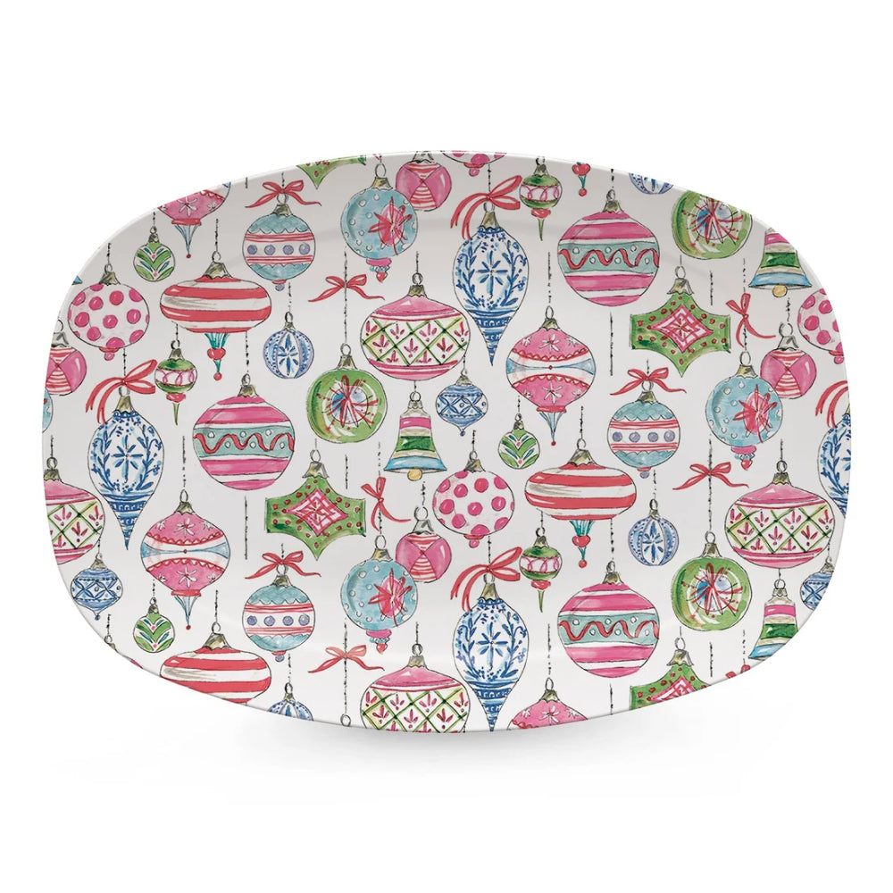An oval serving platter with a colorful Christmas ornament pattern on a white background, featuring pink, blue, green, and red ornaments.