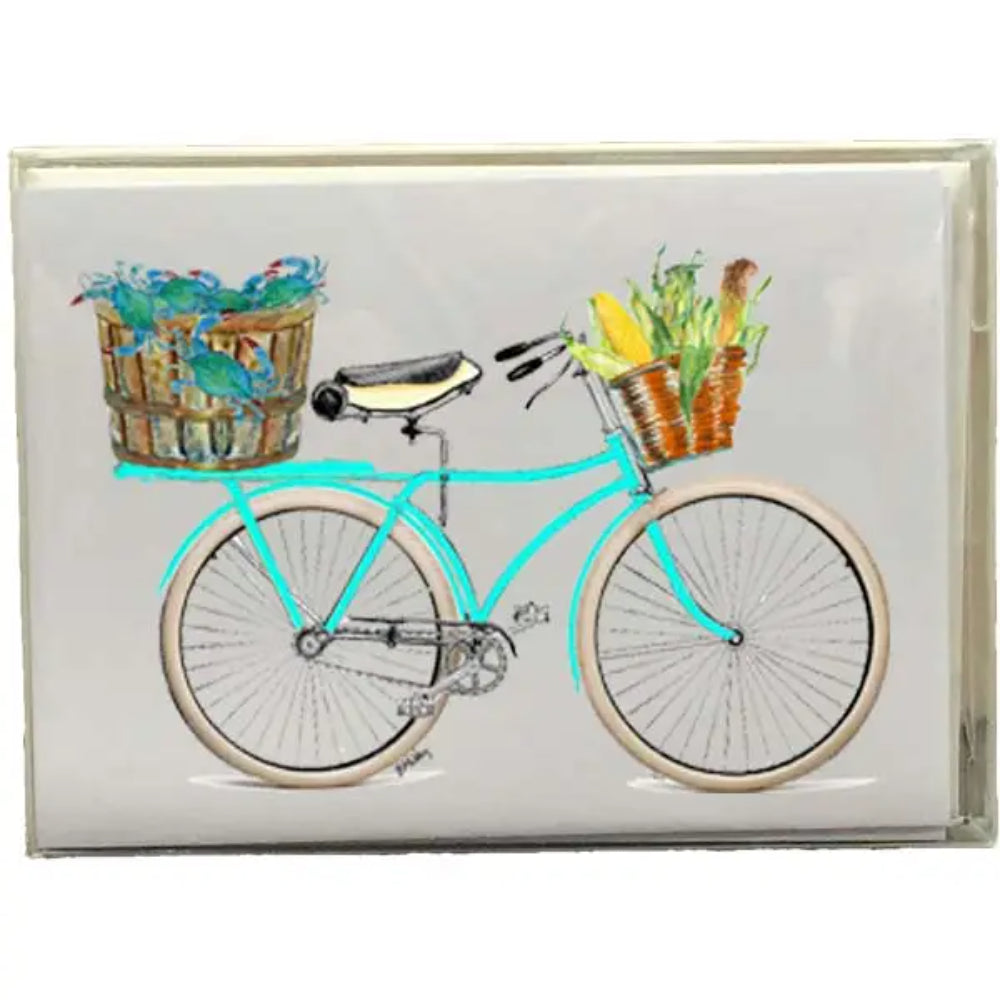 A boxed set of blank note cards with a watercolor illustration of a crab, bike, and food on the cover.