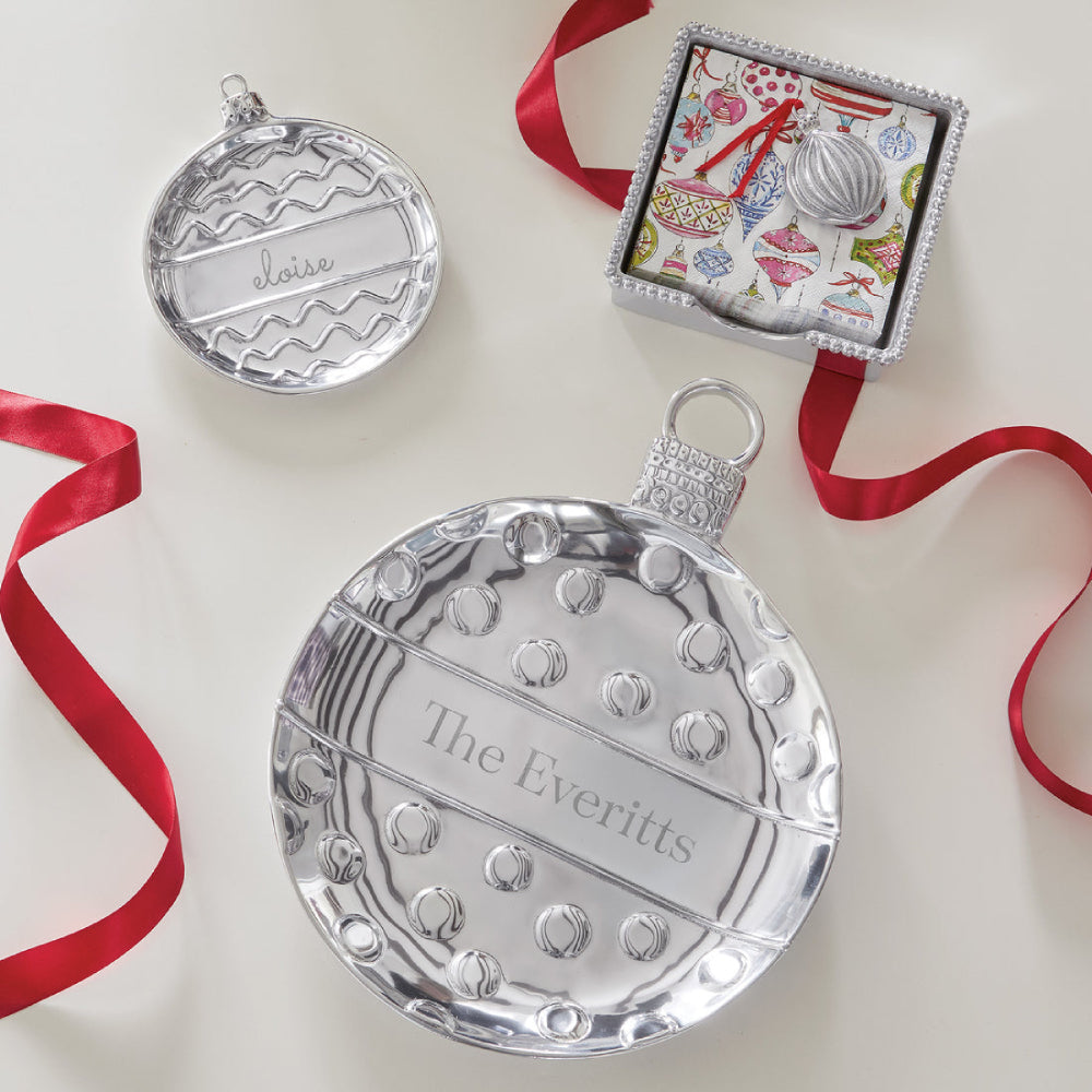 Silver engravable ornament designed plate on a white background