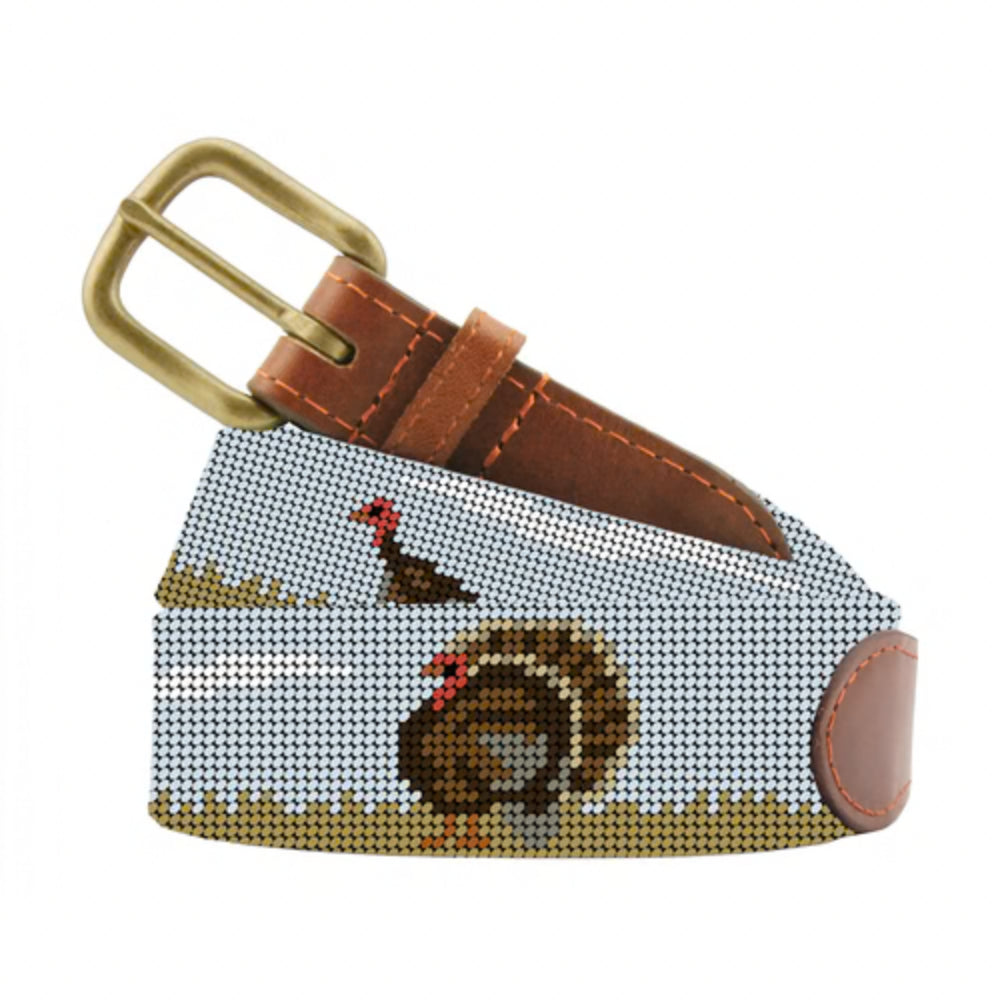 A belt with a turkey on it on a white background. 