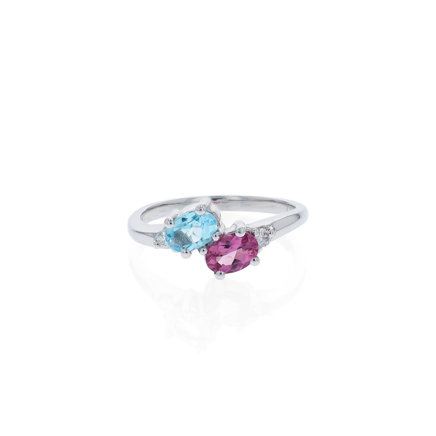 White gold ring with a blue topaz and  pink toumaline center and diamond sides on a white background