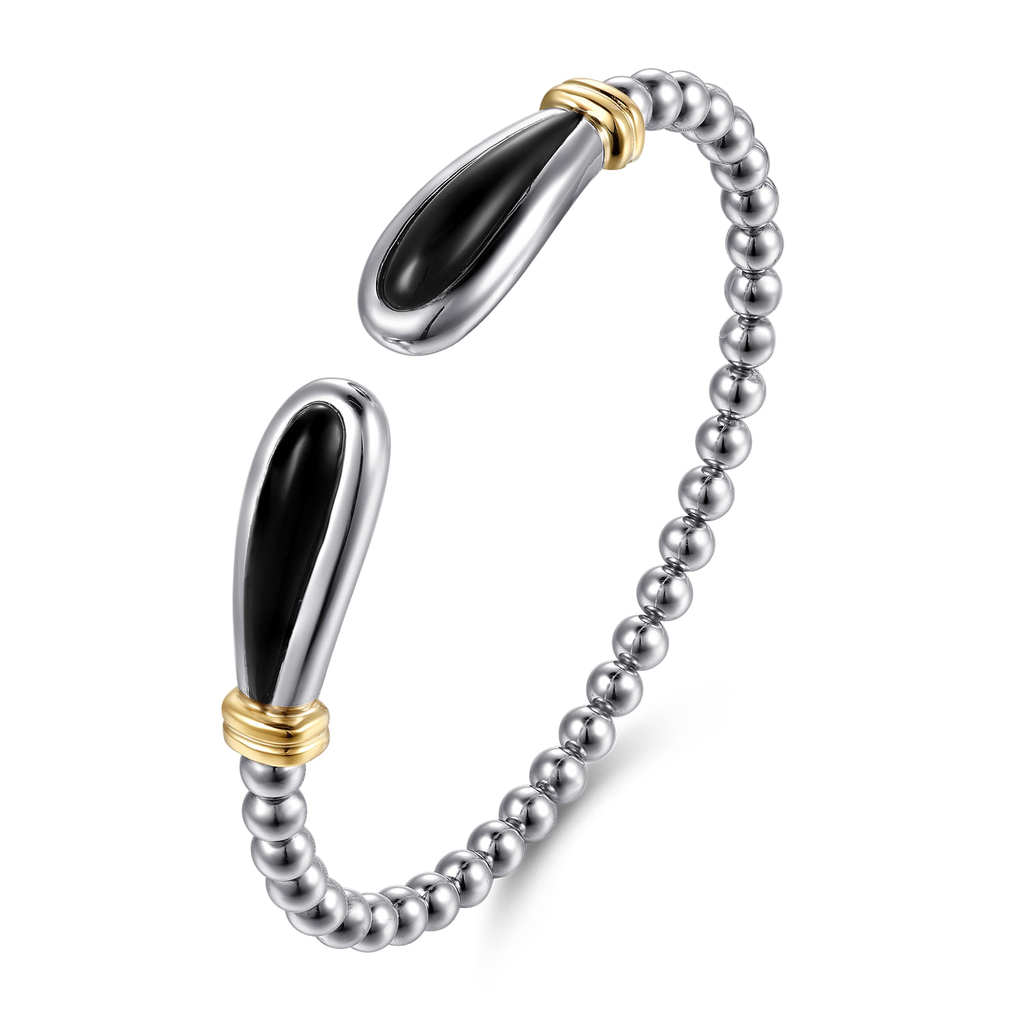 Silver beaded bracelet with black and gold accents on a white background
