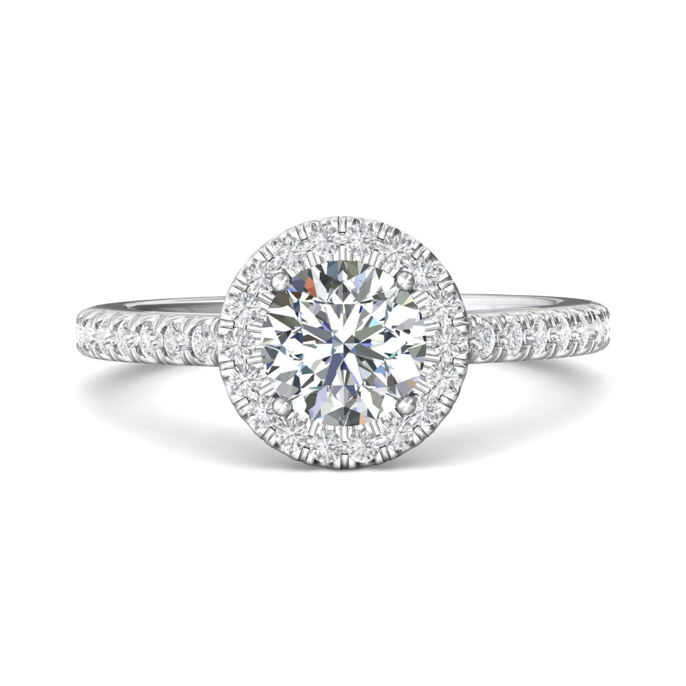 Diamond ring with a halo setting on a white background