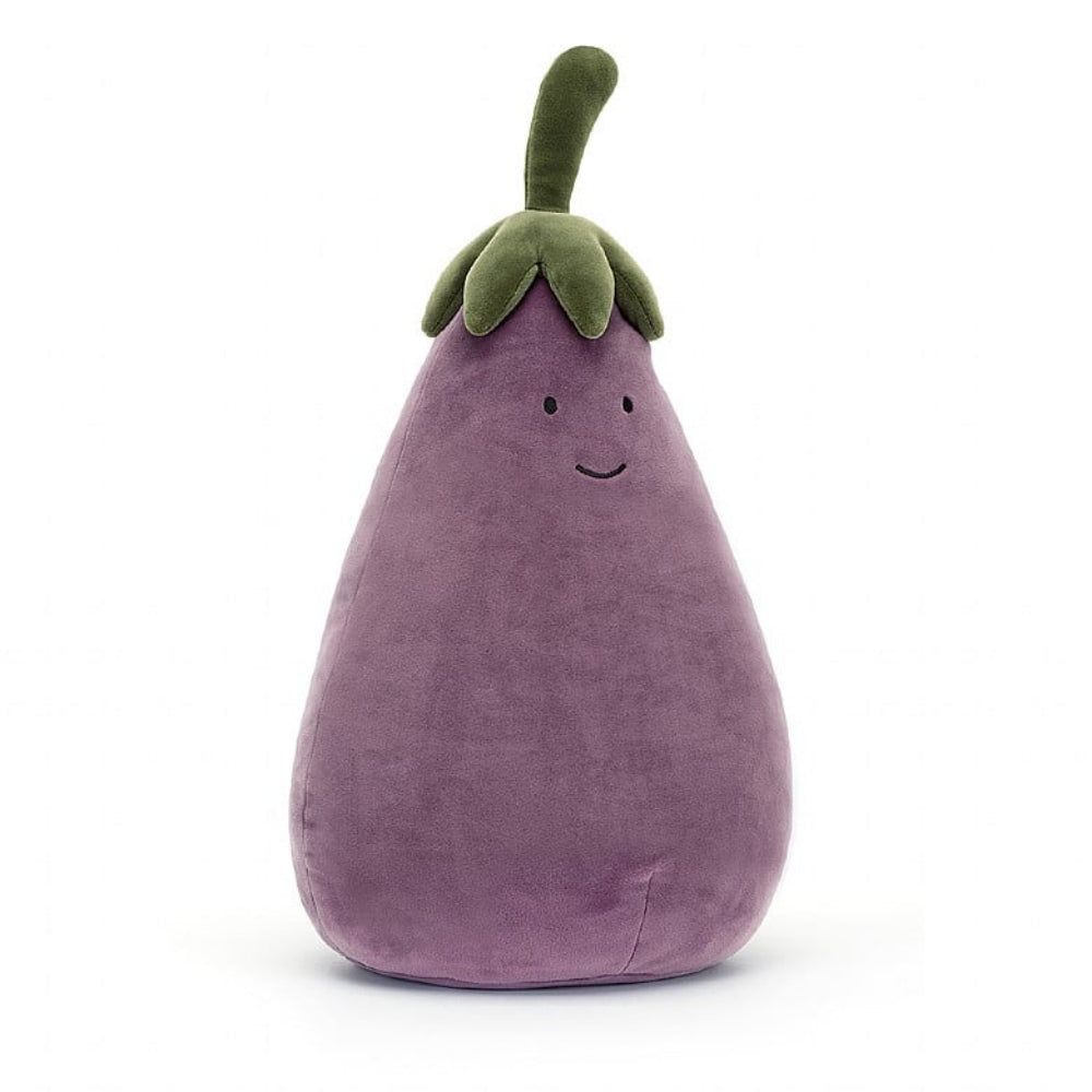 A Large plush toy resembling an aubergine with a smiling face, made from soft fabric with a green stalk on top.