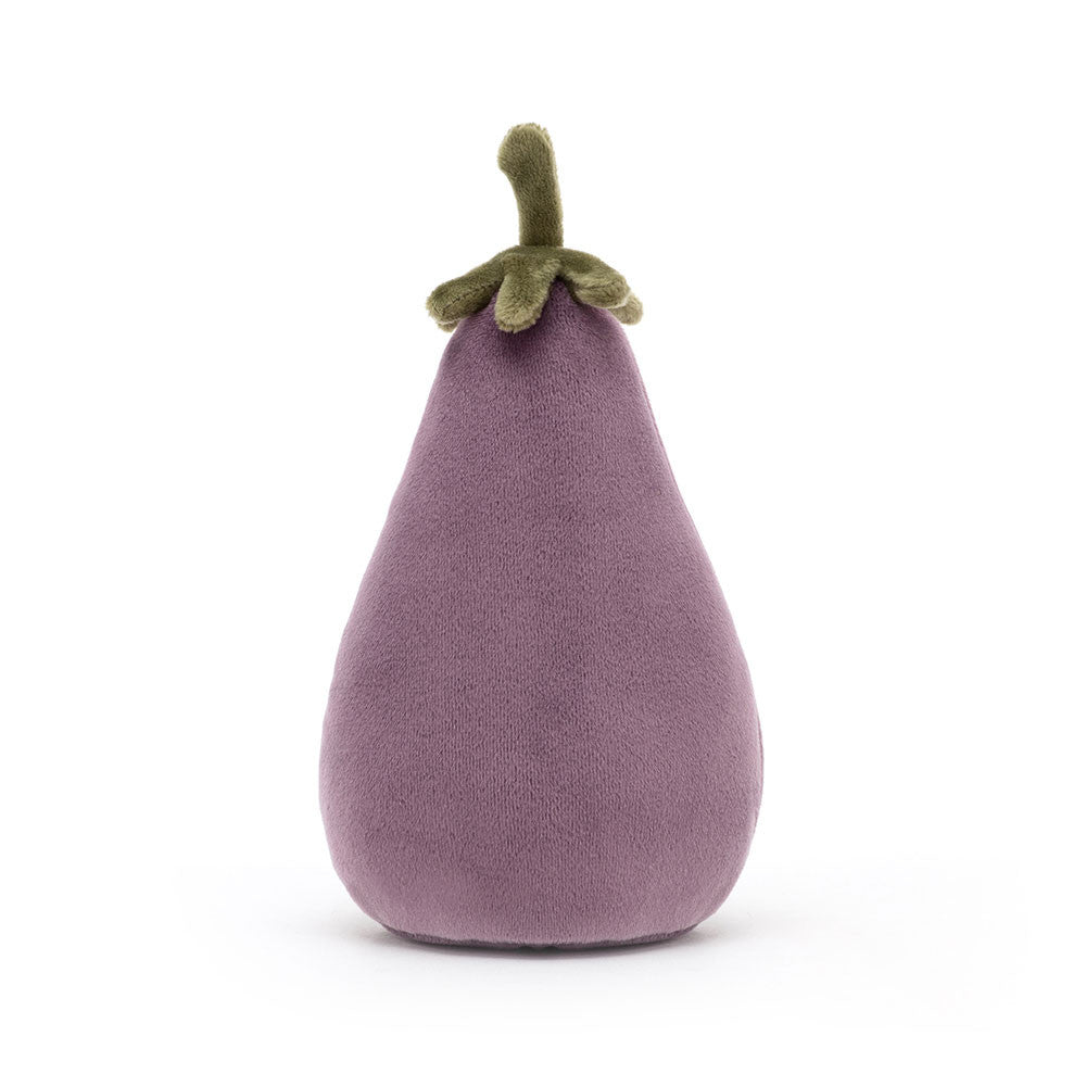 The back of a small  plush toy resembling an aubergine with a smiling face, made from soft fabric with a green stalk on top.