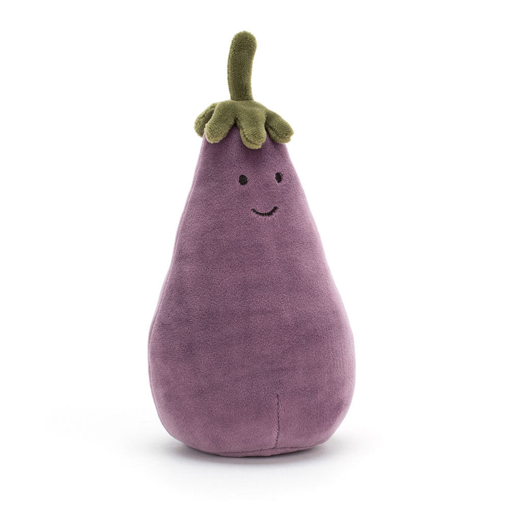 A plush toy resembling an aubergine with a smiling face, made from soft fabric with a green stalk on top.