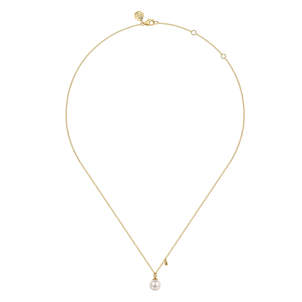 yellow gold necklace with pearl on white background