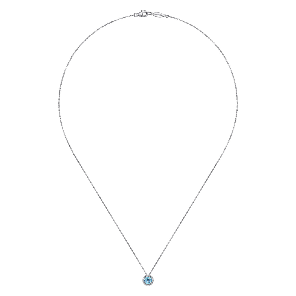 Necklace with a blue gemstone pendant on a white background