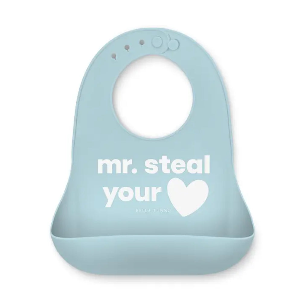 A light blue silicone baby bib with a white printed graphic that reads 'mr. steal your heart' and the brand name 'BELLA TUNNO' underneath, shown on a plain white background.