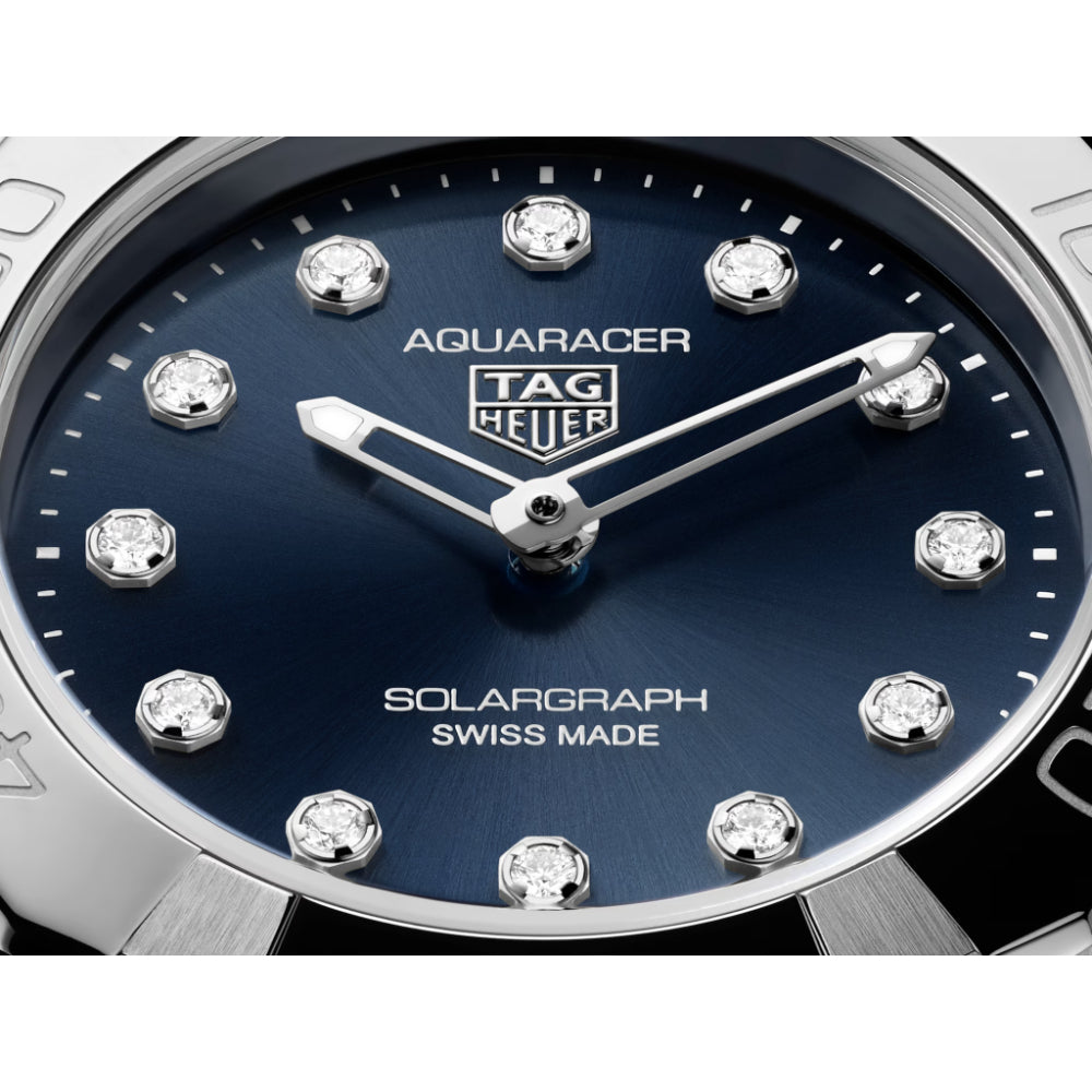 Tag Heuer Aquaracer watch with blue dial and diamond-like accents