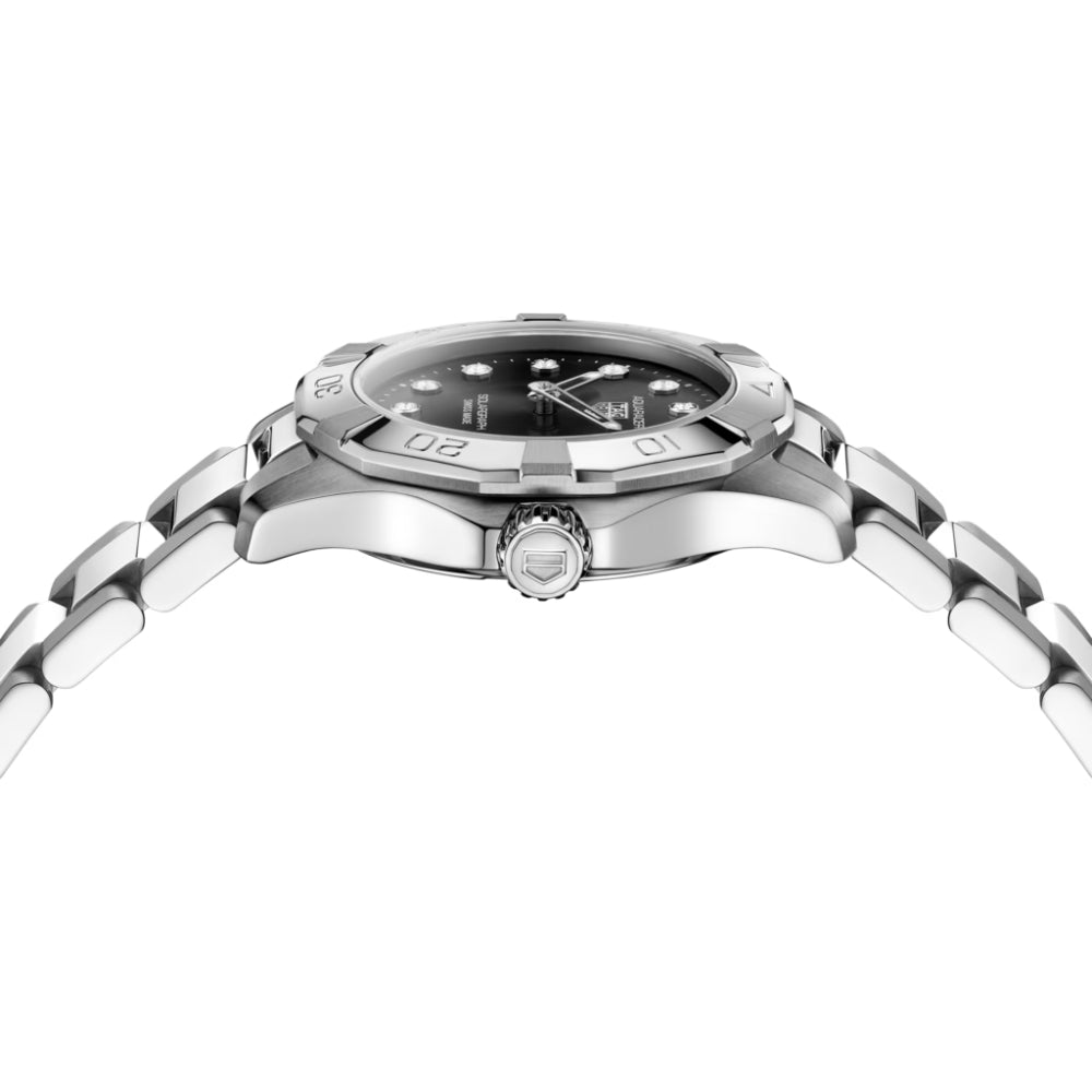 Silver watch with black dial on a white background