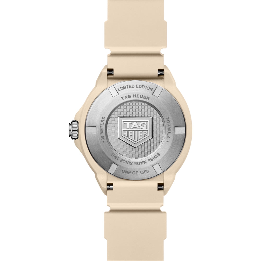 Tag Heuer watch with beige strap and silver dial on a white background