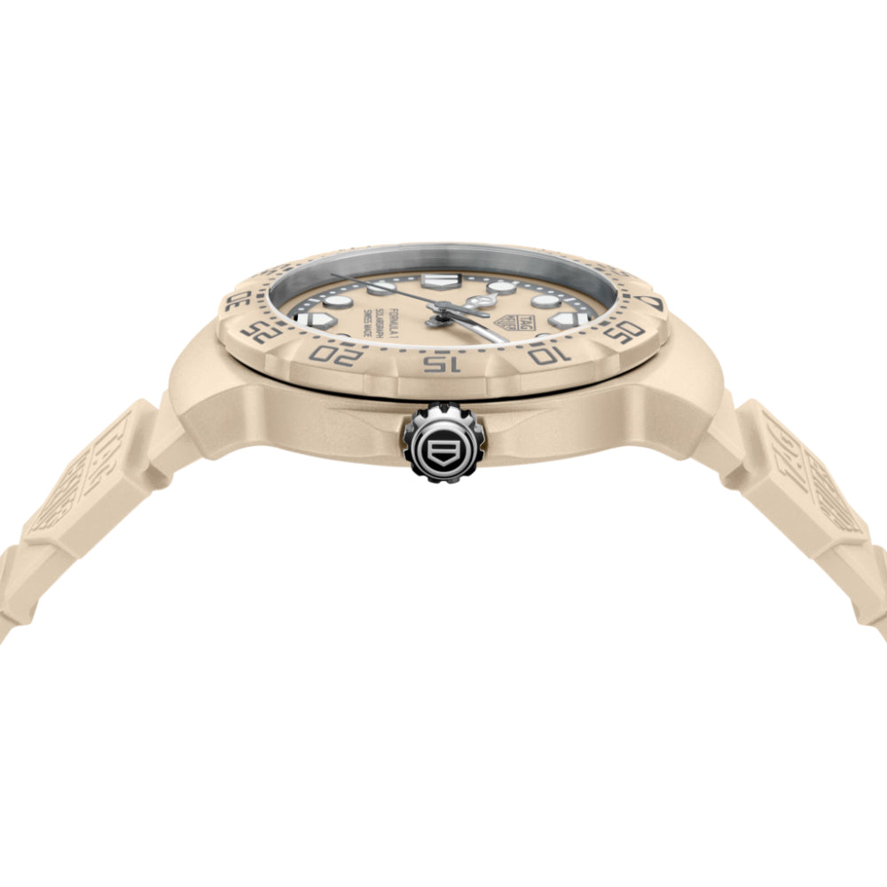 Beige wristwatch with detailed design on a white background