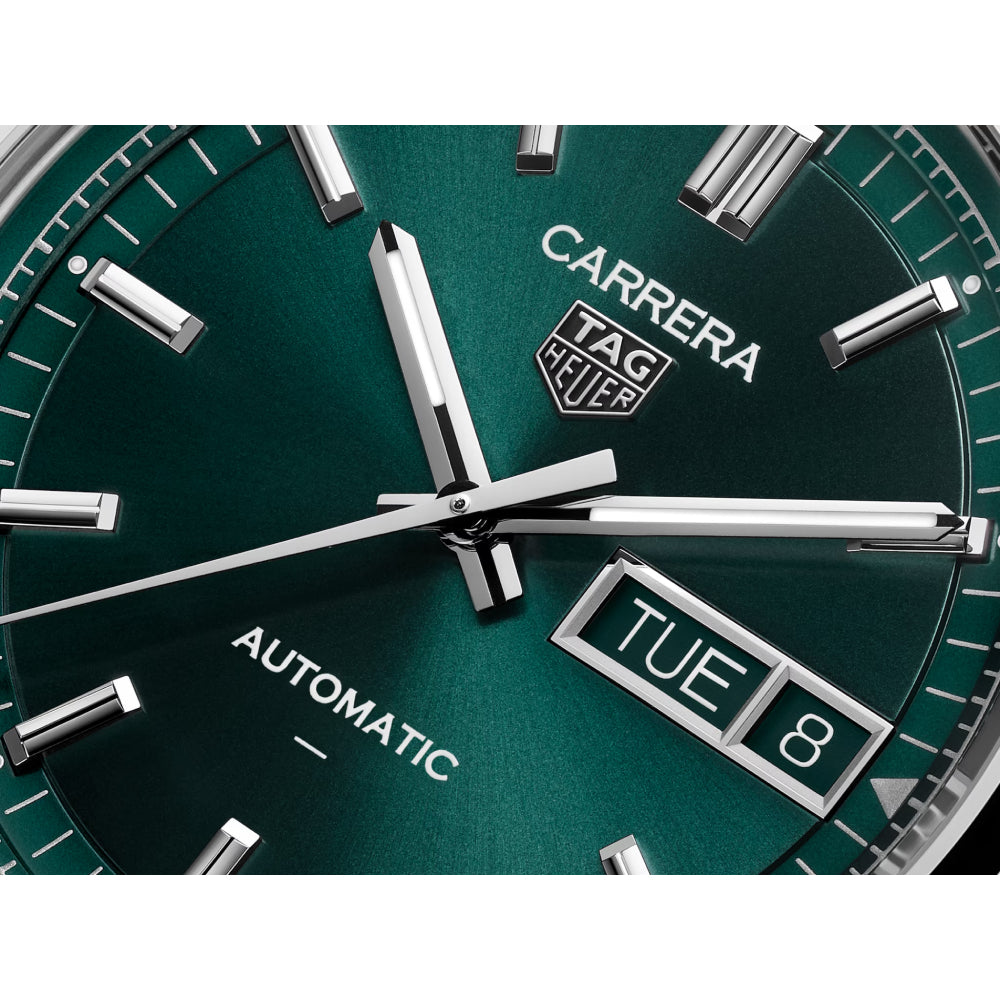 Closeup of a TAG Heuer watch with a green dial