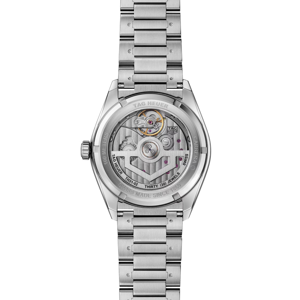 Steel TAG Heuer watch with a clear crystal caseback on a white background