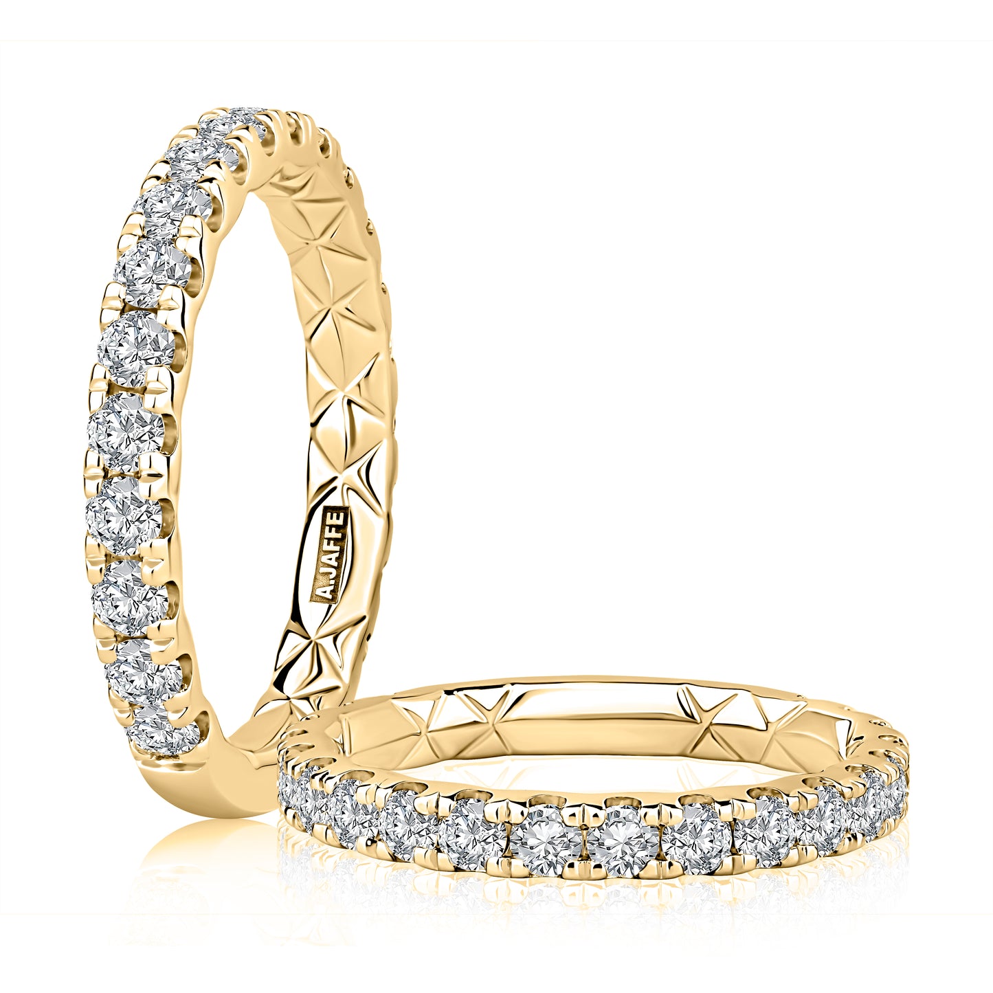 Gold ring with diamond accents on a white background