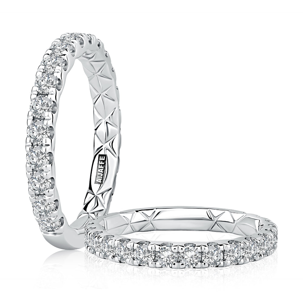 Two diamond eternity rings on a white background