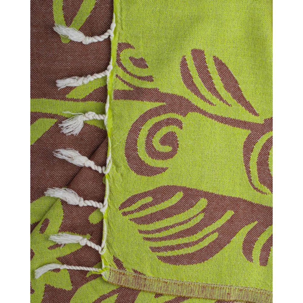  A close up photo of a green and brown towel with brown sea turtle and jellyfish pattern with a white tassel edge on a white background.