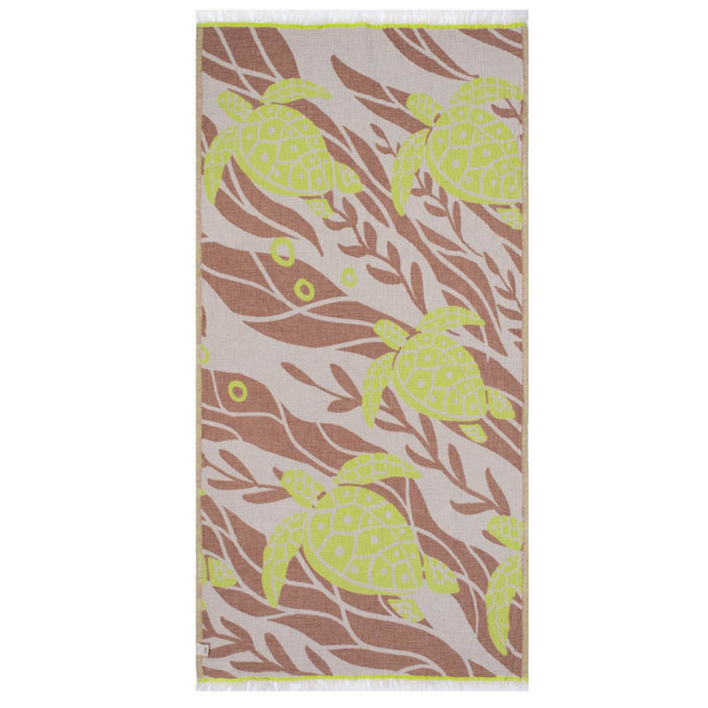 Side two of a beach towel with a yellow and brown sea turtle pattern  and a white tassel edge on a white background.