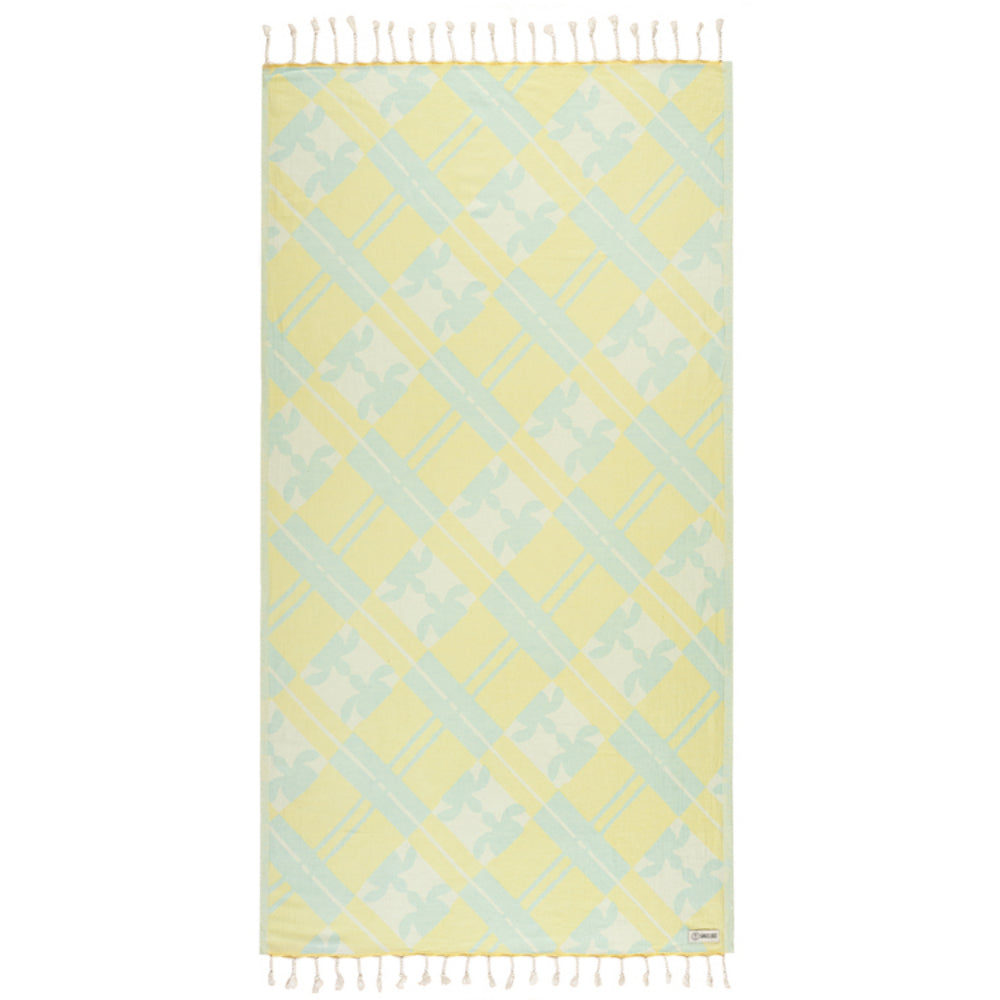 Yellow and light blue patterned towel with white fringe on a white background