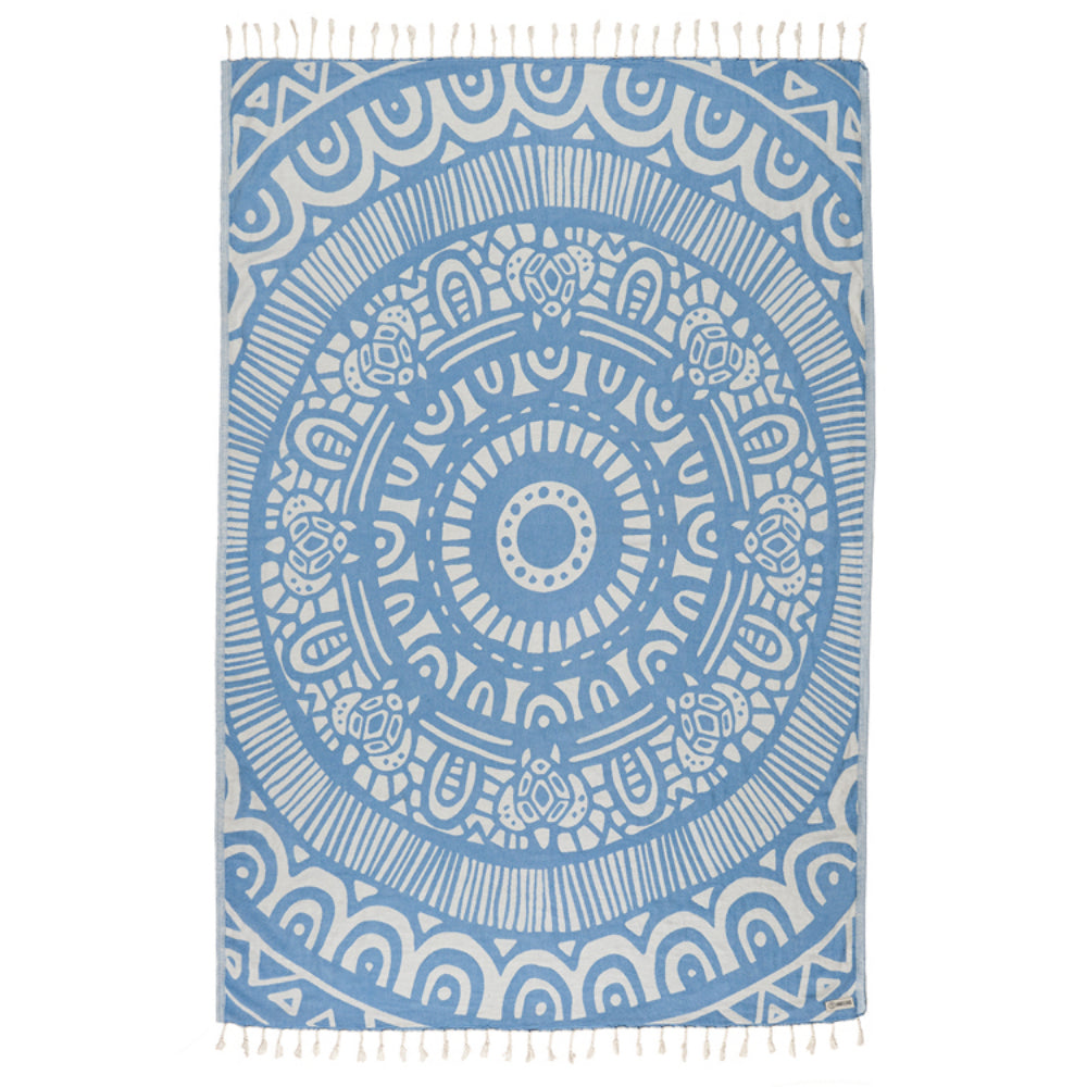 Blue and white patterned towel with fringe on a white background