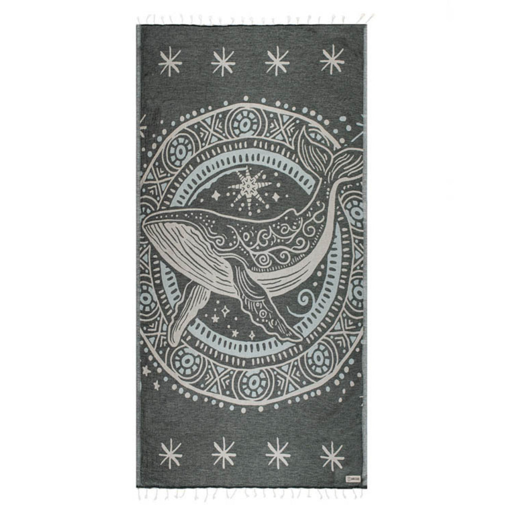 Gray towel with white whale design and star patterns on a white background