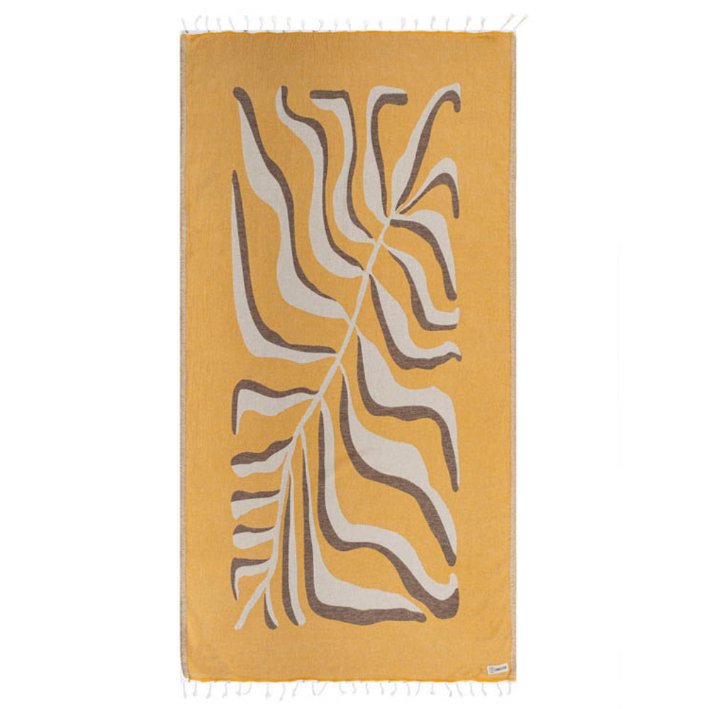 Side one of a reversible yellow  beach towel with a white & grey abstract leaf pattern on a white background