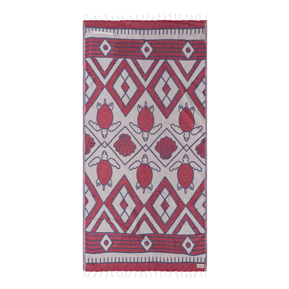 Towel with red and white geometric pattern on a white background