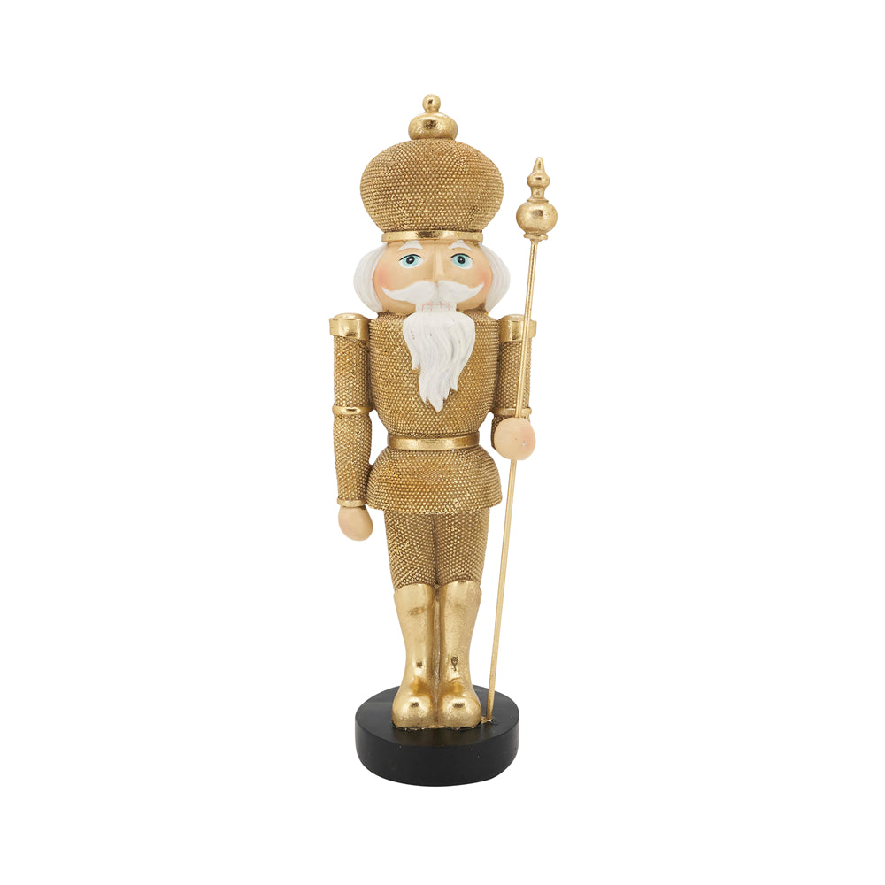 A gold glittery nutcracker soldier figurine holding a spear, standing on a black circular base against a white background.