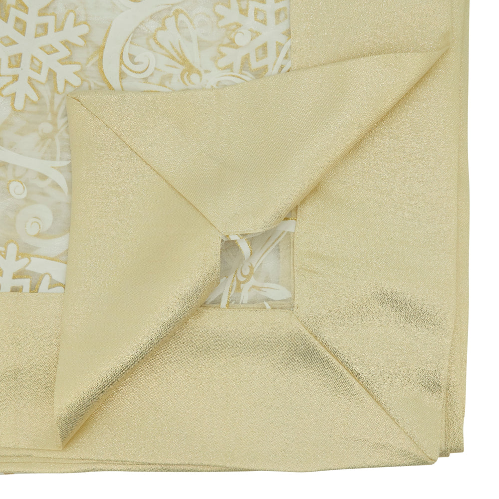 Close-up of a folded beige fabric with snowflake patterns in the background