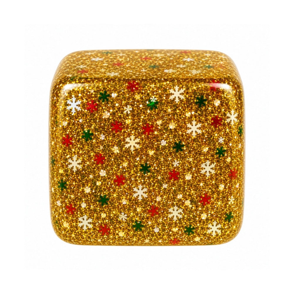 A square squishy covered in sparkling gold glitter with scattered white snowflakes and small red and green accents, shown on a plain white background.