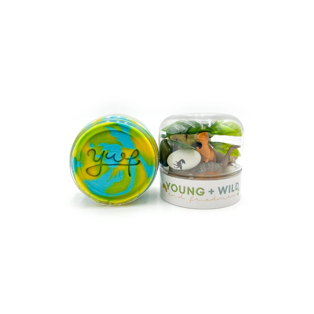 Two small containers of slime on a white background
