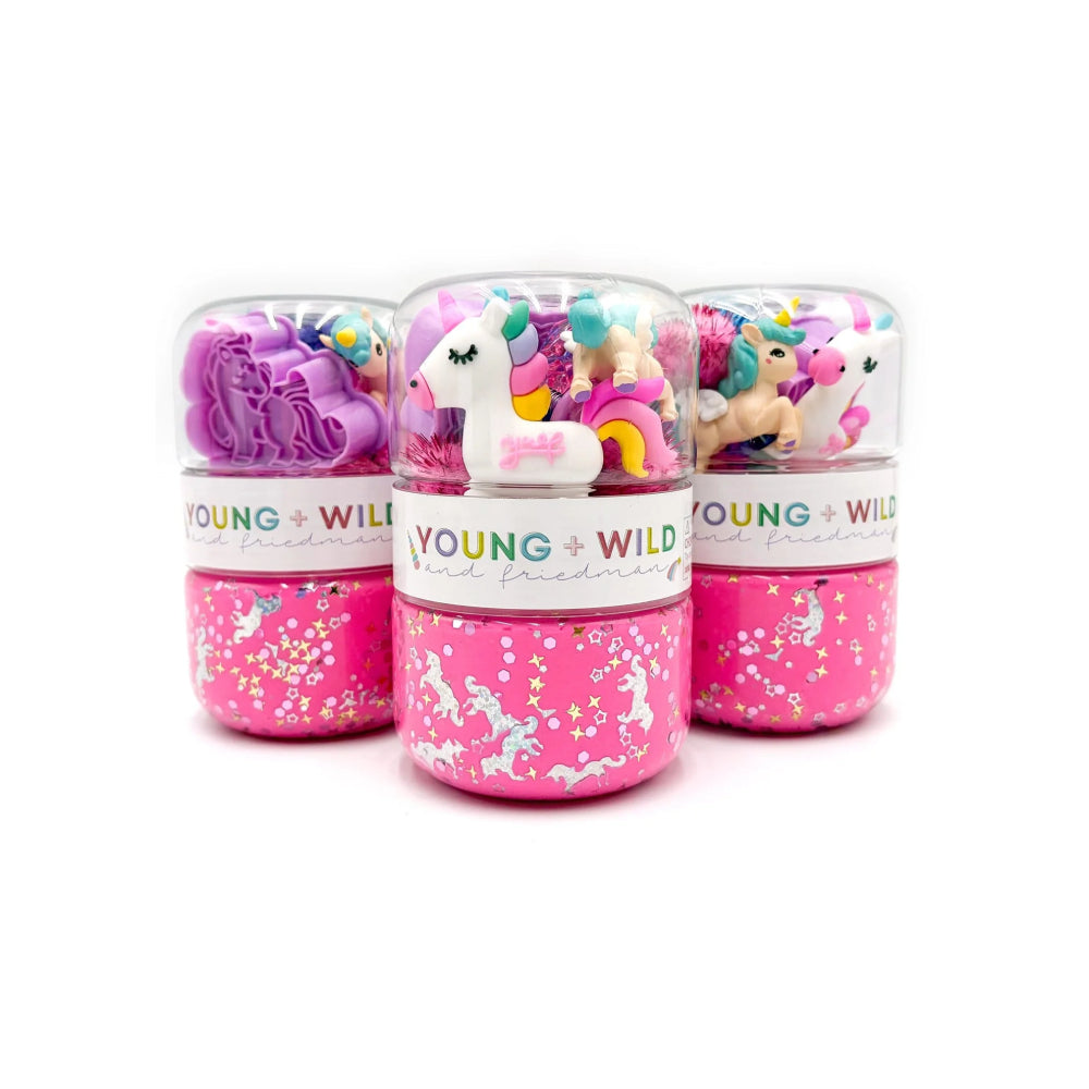 Three pink slime containers with unicorn designs and 'Young & Wild' branding on a white background.