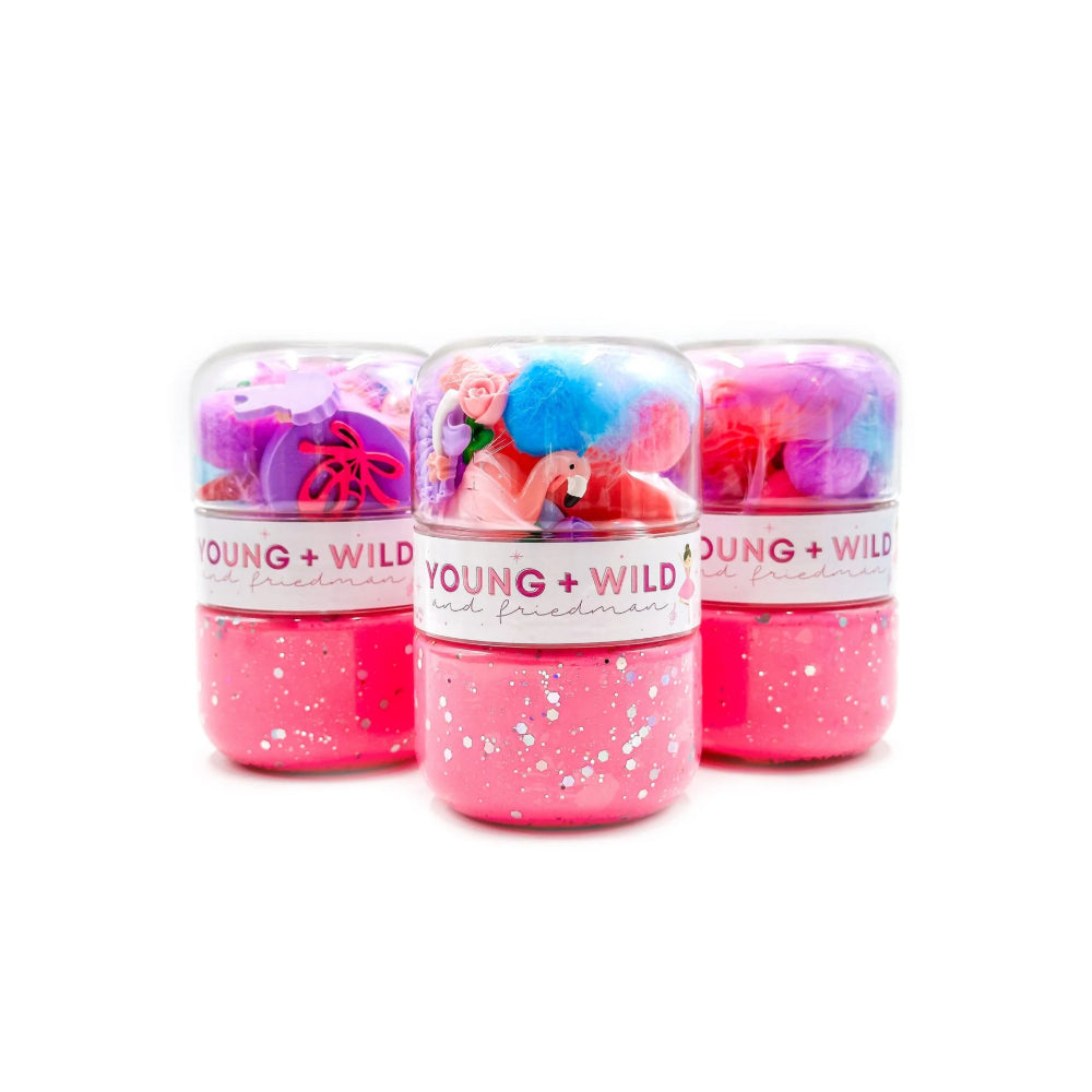 Three pink dough jars with colorful contents on a white background, featuring the 'Young & Wild' brand.