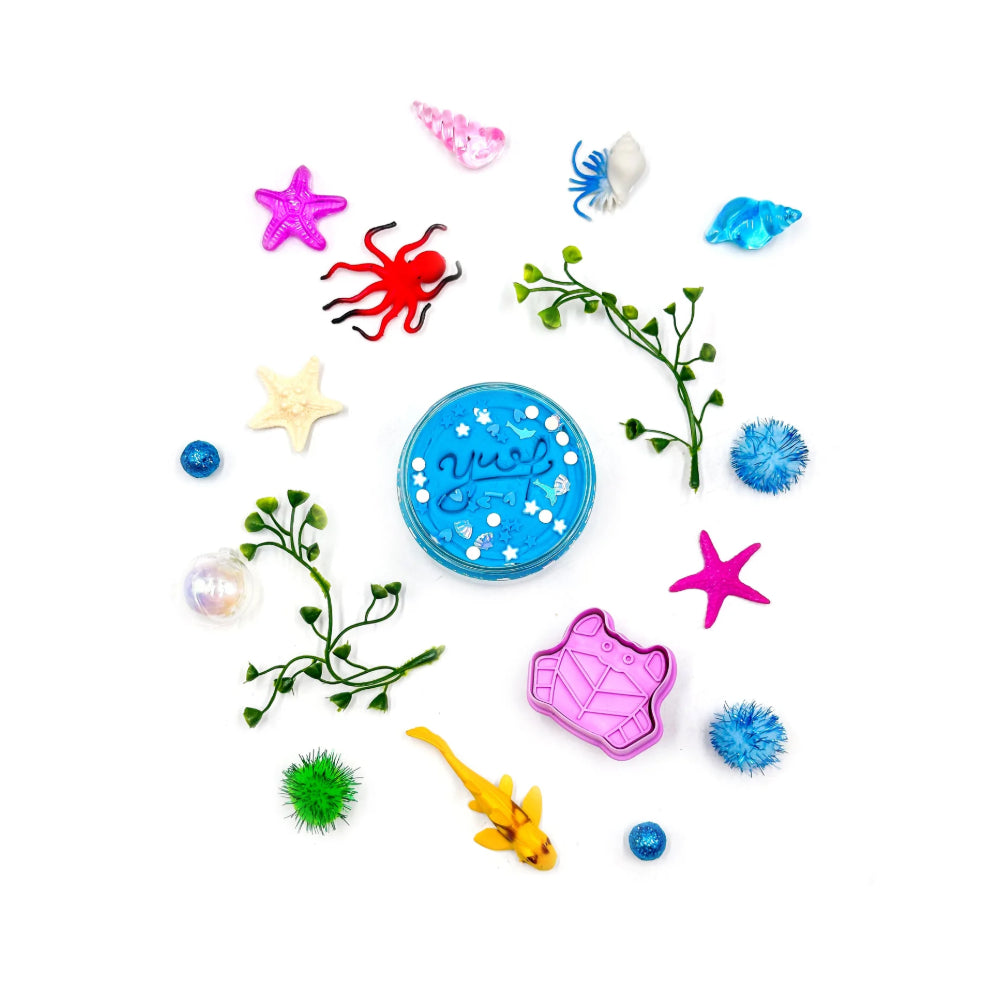 Colorful sea-themed toys and accessories on a white background