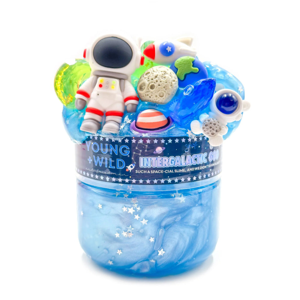 Space-themed slime with astronaut and galaxy decorations in a clear jar on a white background