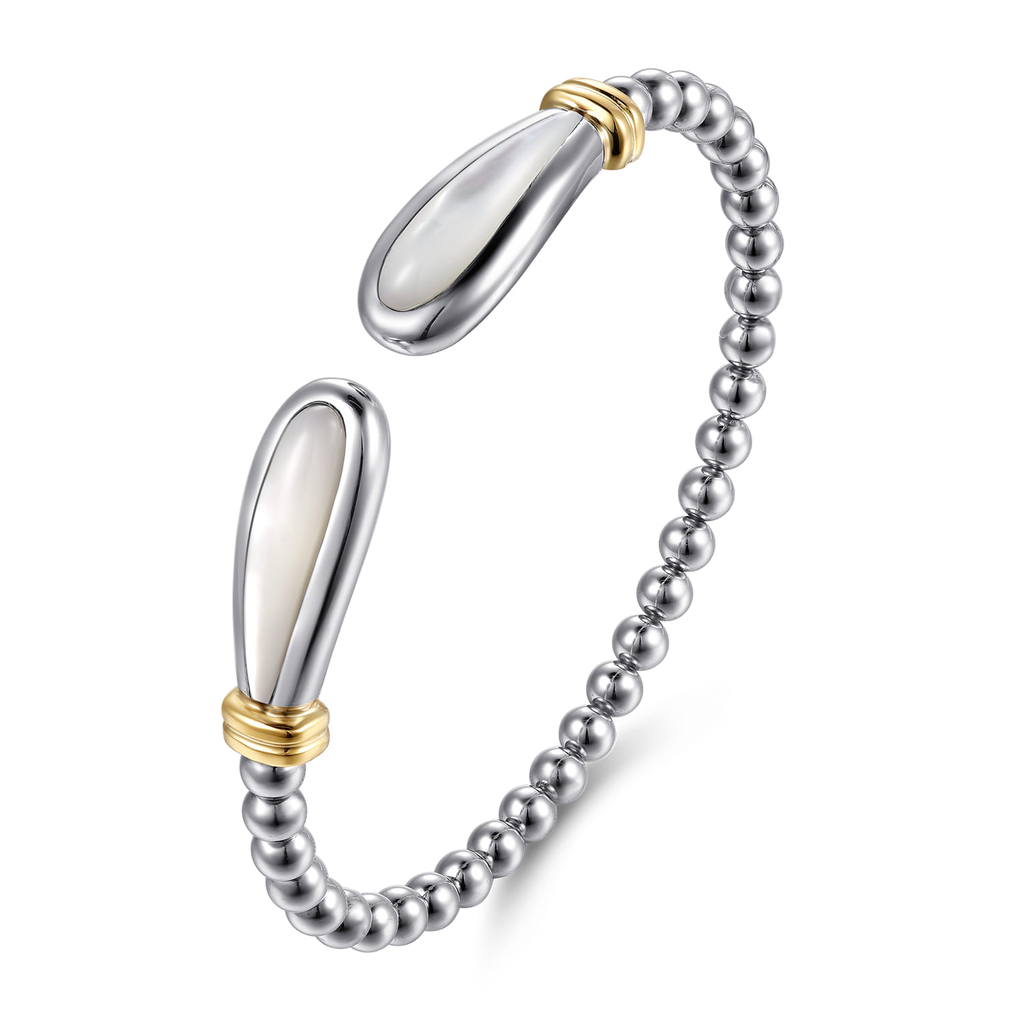 Silver beaded bracelet with gold accents on a white background