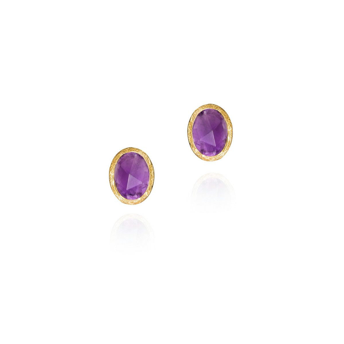 purple stones in gold frame on white background