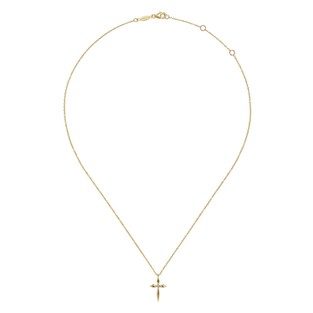 Gold necklace with a cross pendant on a white background