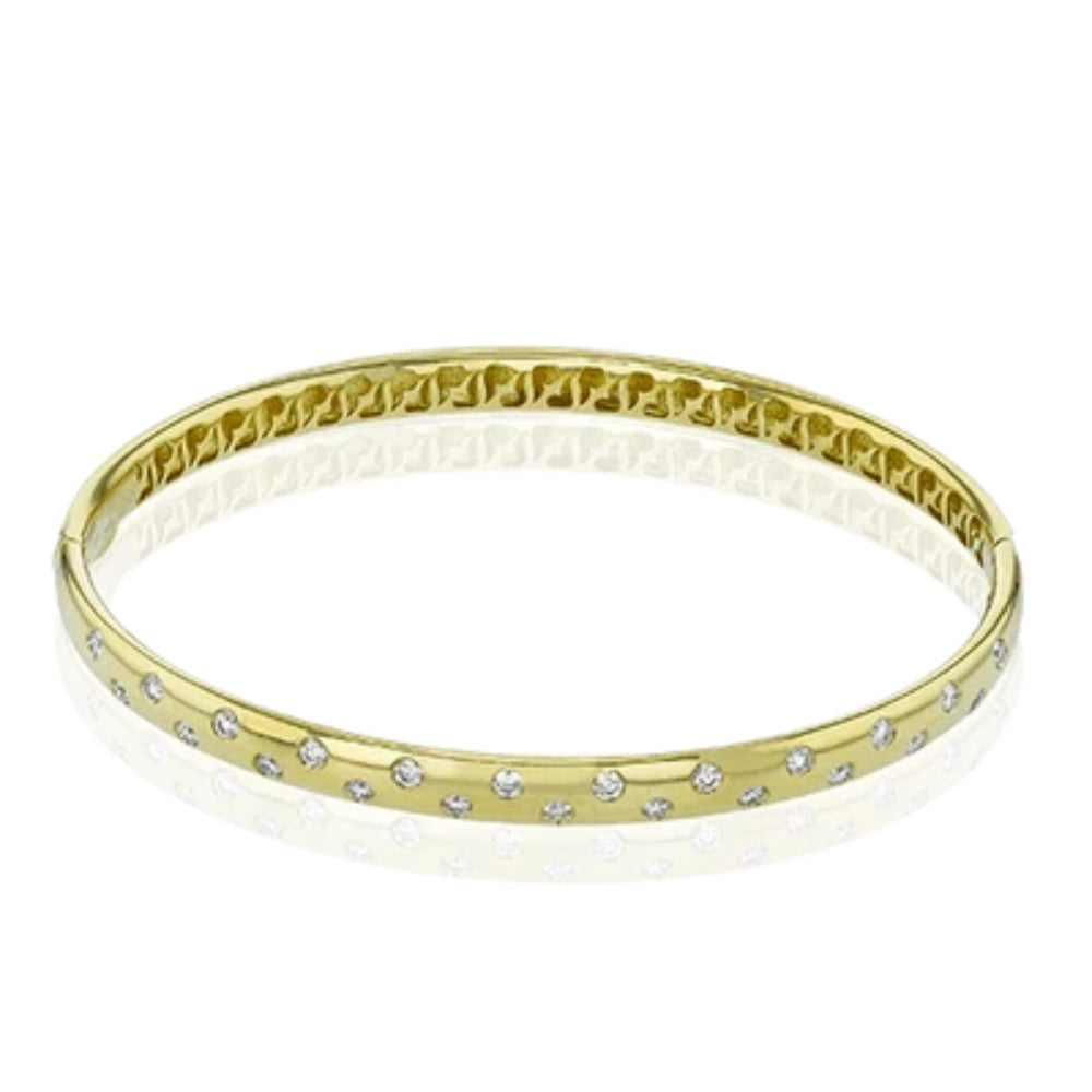 gold bracelet with clear stones on a white background
