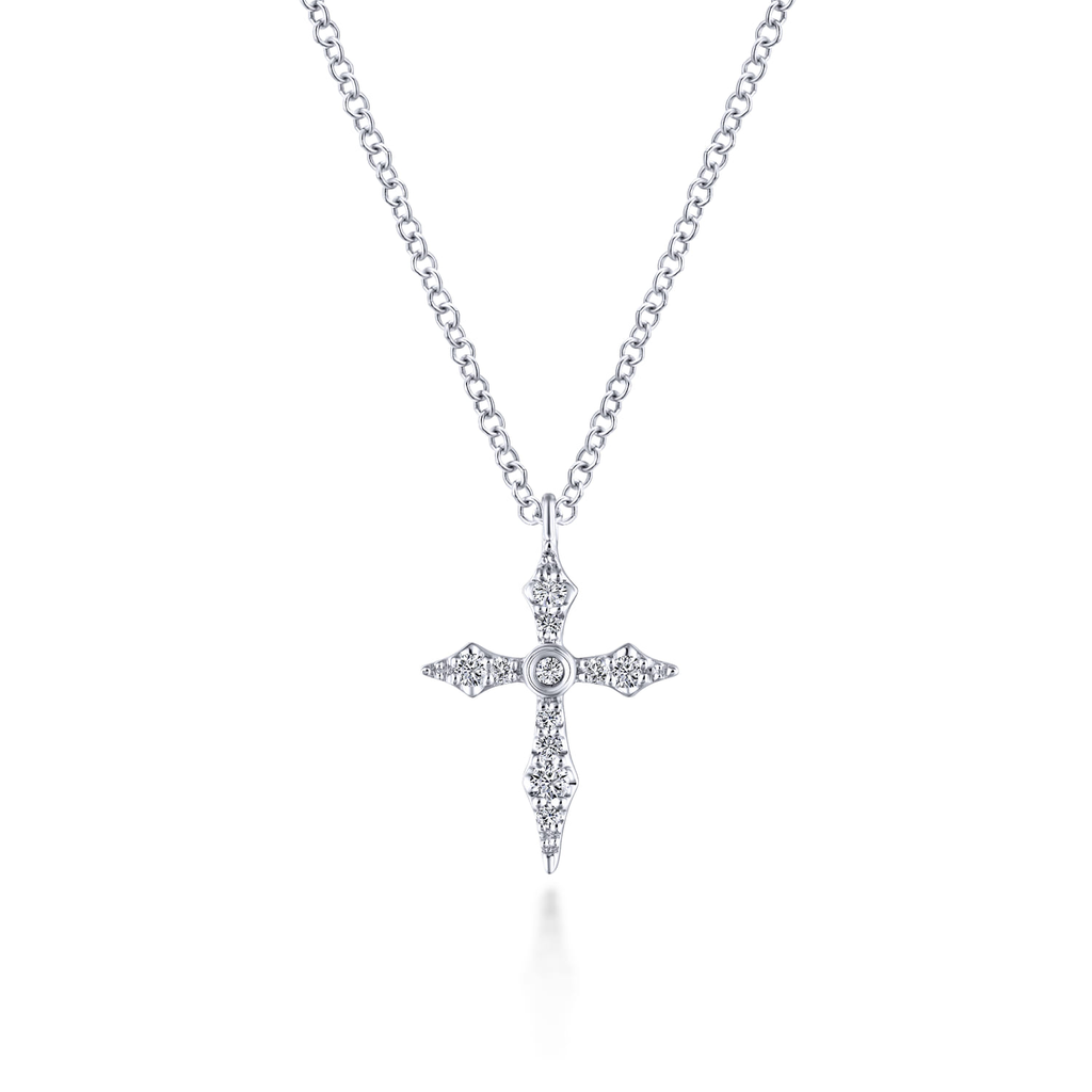 Silver cross pendant necklace on a white background