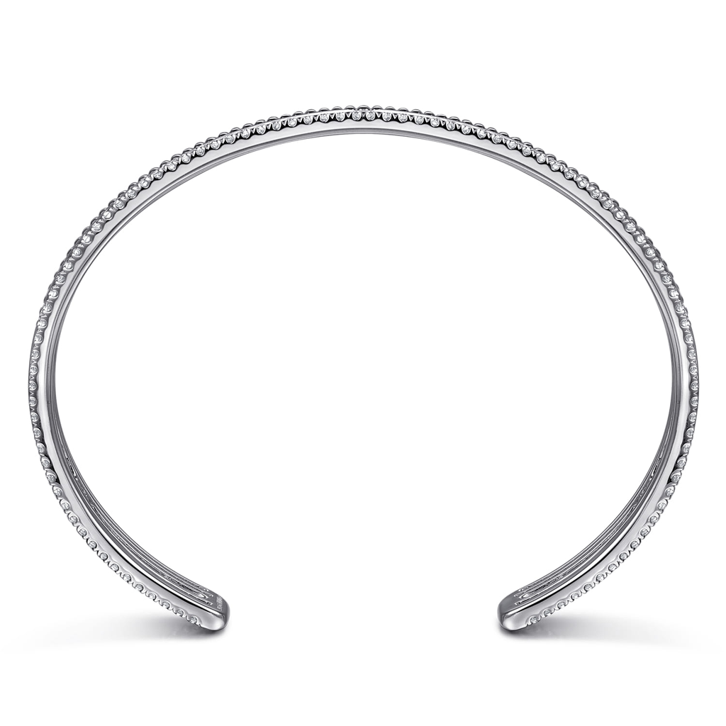 Silver bracelet with small stones on a white background