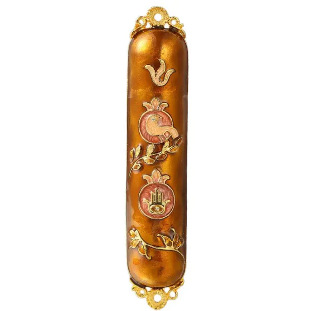 A gold-colored mezuzah with floral patterns and crystal accents on white background
