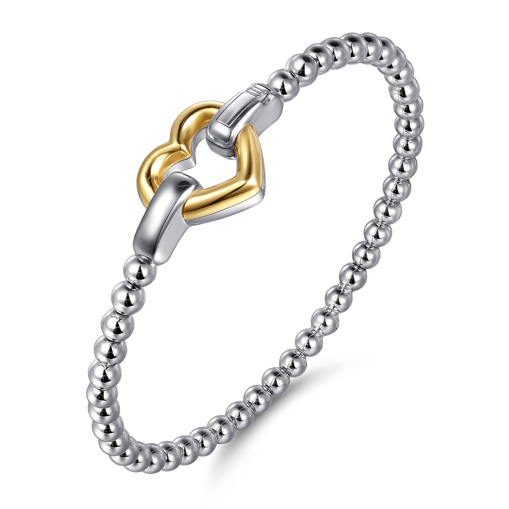 Silver and gold beaded bracelet on a white background