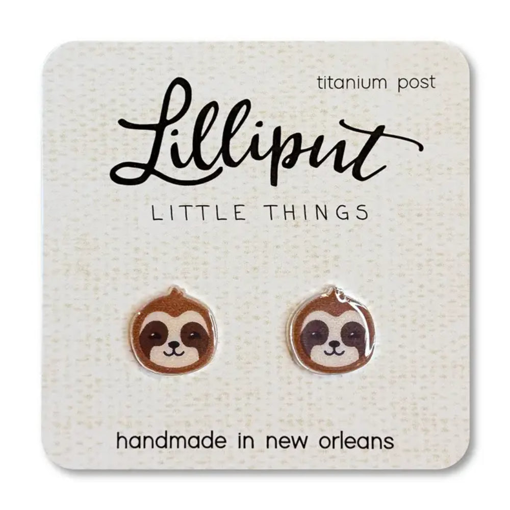 Sloth-shaped earrings on a Lilliput Little Things branded card.