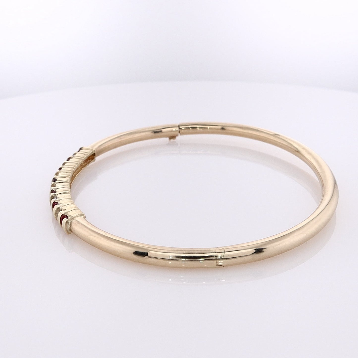 Estate 14 Karat Yellow Gold Alternating Diamond and Ruby Hinged Bangle Bracelet